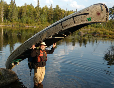 Dan Portaging the Canoe
