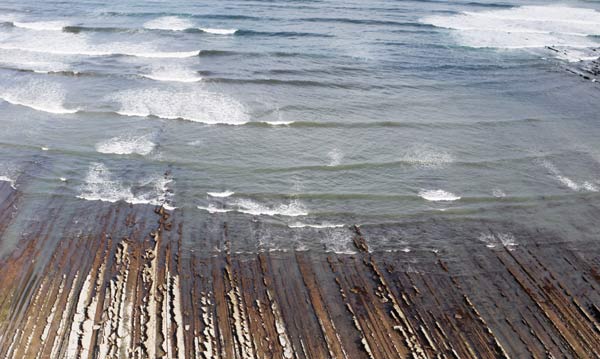 Waves and layered rocks