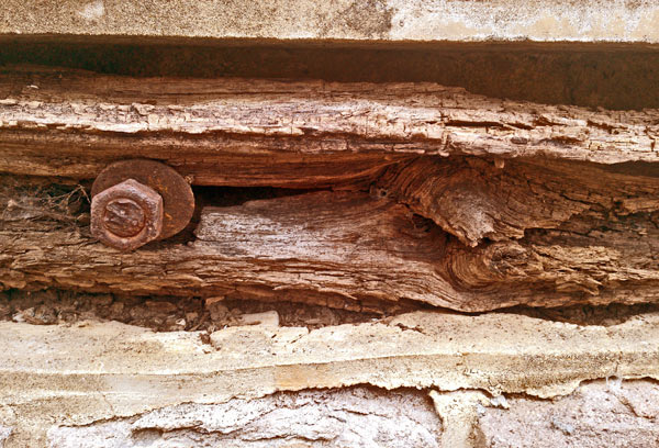 Wooden Boat Bumper in Canal Wall