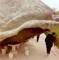 The rain gutter on this overhanging boulder is carved into the rock.